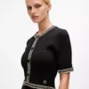 Abito in maglia con dettagli bouclé Abito in maglia con dettagli bouclé