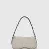 Borsa a tracolla con borchie e occhiali da sole Borsa a tracolla con borchie e occhiali da sole