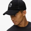 Cappellino trucker con monogramma Cappellino trucker con monogramma
