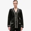 Cardigan con dettagli bouclé Cardigan con dettagli bouclé