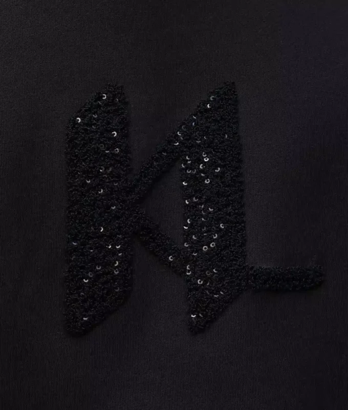 Felpa con monogramma in paillettes