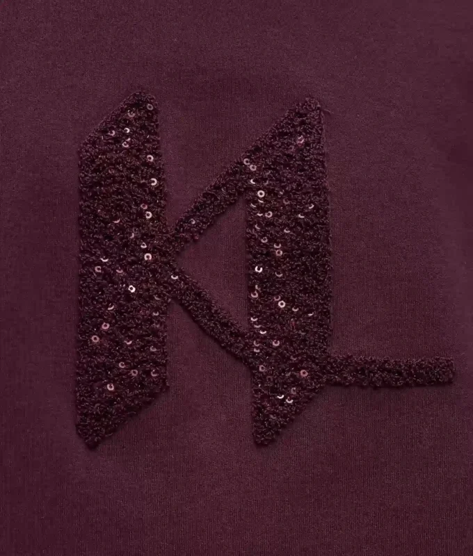Felpa con monogramma in paillettes