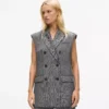 Gilet in tweed con revers in paillettes Gilet in tweed con revers in paillettes