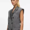 Gilet in tweed con revers in paillettes Gilet in tweed con revers in paillettes