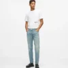 Jeans affusolati con spruzzi di vernice