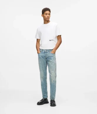 Jeans affusolati con spruzzi di vernice