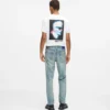 Jeans affusolati con spruzzi di vernice
