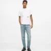 Jeans affusolati con spruzzi di vernice