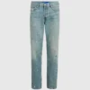 Jeans affusolati con spruzzi di vernice
