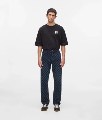 Jeans con monogramma su tutta la superficie