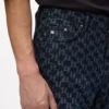 Jeans con monogramma su tutta la superficie Jeans con monogramma su tutta la superficie