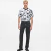 Jeans dritti con monogramma su tutta la superficie