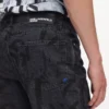 Jeans dritti con monogramma su tutta la superficie