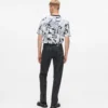 Jeans dritti con monogramma su tutta la superficie