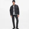 Jeans dritti con monogramma su tutta la superficie
