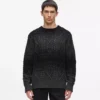 Maglione lavorato a trecce