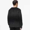 Maglione lavorato a trecce