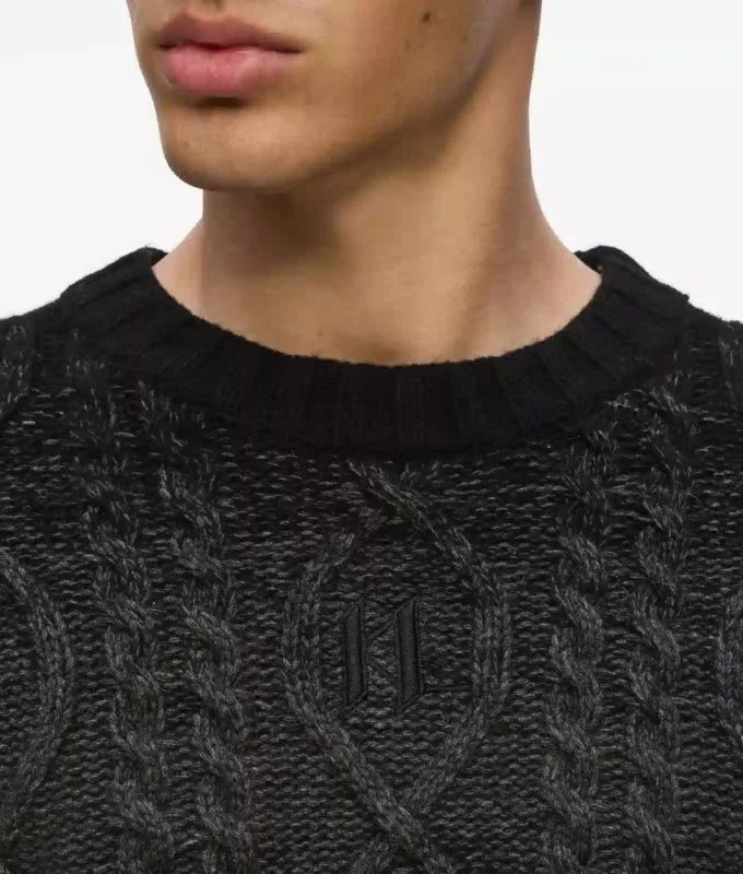 Maglione lavorato a trecce