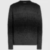 Maglione lavorato a trecce