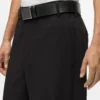Pantaloni con bordino tono su tono
