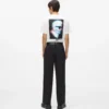 Pantaloni con bordino tono su tono