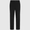 Pantaloni con bordino tono su tono