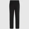 Pantaloni con bordino tono su tono