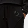 Pantaloni della tuta con monogramma borchiato Pantaloni della tuta con monogramma borchiato