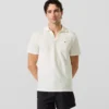 Polo con spilla Monogram