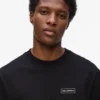 T-shirt a maniche lunghe con patch logo T-shirt a maniche lunghe con patch logo