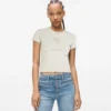 T-shirt con monogramma borchiato T-shirt con monogramma borchiato