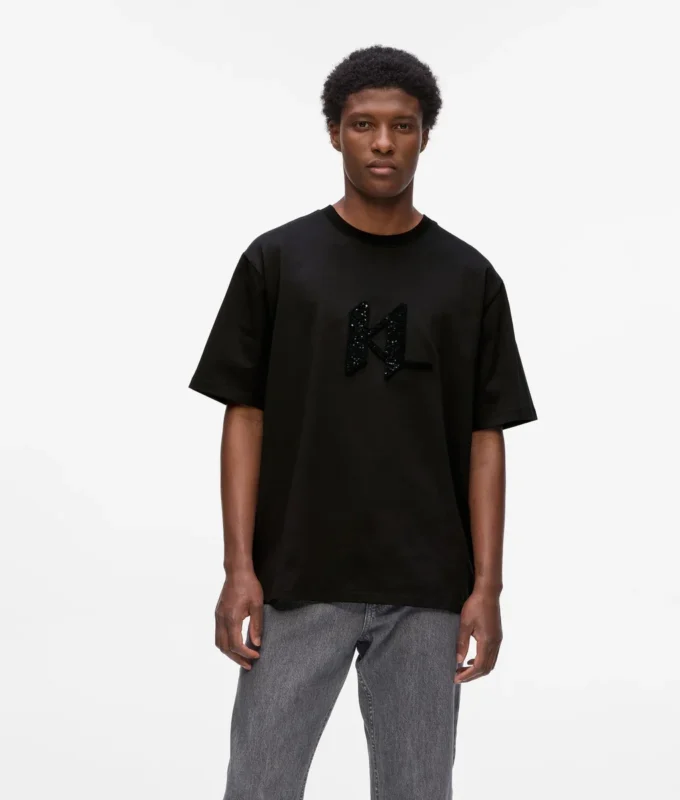 T-shirt con monogramma in paillettes T-shirt con monogramma in paillettes