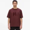 T-shirt con monogramma in paillettes T-shirt con monogramma in paillettes