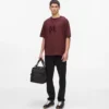 T-shirt con monogramma in paillettes T-shirt con monogramma in paillettes