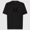 T-shirt con monogramma in paillettes T-shirt con monogramma in paillettes