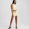TOP SENZA MANICHE CON ZIP FRONTALE
